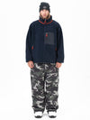 Pantalon de ski ample et zippé en polaire sherpa synthétique pour homme, avec genoux renforcés.