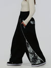 Pantalon de jogging ample pour femme, style jogging, avec empiècements et bandes réfléchissantes, style graffiti, couleur Hyper Flux.