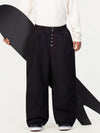 Pantalon de travail en denim brut à rivets pour homme, coupe oversize, avec double poche arrière.