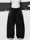 Pantalon de ski freestyle extra ample Hyper Flux pour femme, fermeture éclair latérale et empiècement graffiti.