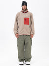 Pantalon de ski ample et zippé en polaire sherpa synthétique pour homme, avec genoux renforcés.