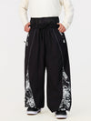 Pantalon de jogging ample de ski pour homme, style graffiti, avec empiècements colorés et bandes réfléchissantes.