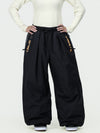 Pantalon de ski freestyle extra ample Hyper Flux pour femme, fermeture éclair latérale et empiècement graffiti.