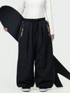 Pantalon de ski freestyle extra ample Hyper Flux pour femme, fermeture éclair latérale et empiècement graffiti.