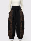 Pantalon de neige extra ample Wild Motion pour femme, à blocs de couleurs réfléchissants.