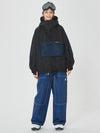 Combinaison de snowboard ample pour femme, style freeride.