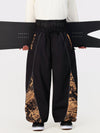 Pantalon de jogging ample de ski pour homme, style graffiti, avec empiècements colorés et bandes réfléchissantes.