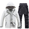 Ensemble veste et pantalon de ski isolés pour homme, idéal pour la montagne.