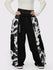 Pantalon de neige extra ample Wild Motion pour femme, à blocs de couleurs réfléchissants.