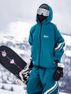 Combinaison de ski ample deux pièces John Snow Freestyle pour femme, à rayures latérales.