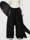 Pantalon de ski freestyle extra ample Hyper Flux pour femme, fermeture éclair latérale et empiècement graffiti.