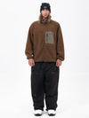 Pantalon de ski ample et zippé en polaire sherpa synthétique pour homme, avec genoux renforcés.