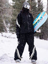 Combinaison de ski ample deux pièces John Snow Freestyle pour femme, à rayures latérales.