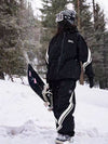 Combinaison de ski ample deux pièces John Snow Freestyle pour femme, à rayures latérales.