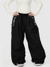 Pantalon de ski freestyle extra ample Hyper Flux pour femme, fermeture éclair latérale et empiècement graffiti.