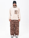 Pantalon de ski ample et zippé en polaire sherpa synthétique pour homme, avec genoux renforcés.