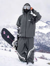 Combinaison de ski ample deux pièces John Snow Freestyle pour femme, à rayures latérales.
