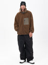 Pantalon de ski ample et zippé en polaire sherpa synthétique pour homme, avec genoux renforcés.