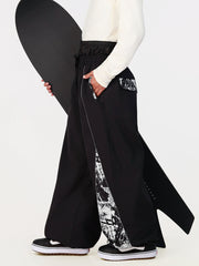 Pantalon de jogging ample de ski pour homme, style graffiti, avec empiècements colorés et bandes réfléchissantes.