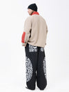 Pull en polaire sherpa synthétique pour homme et pantalon de ski cargo réfléchissant.