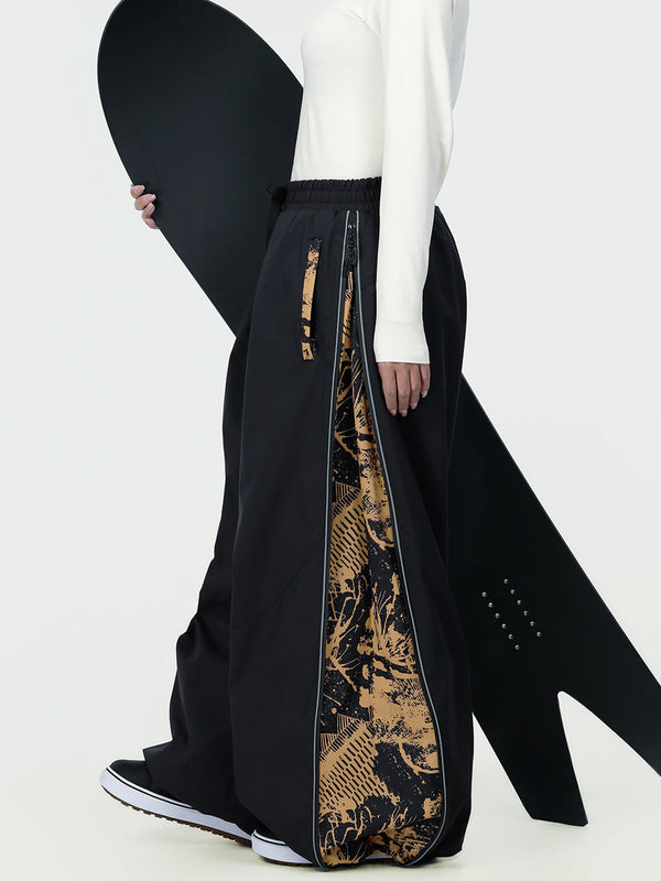Pantalon de ski freestyle extra ample Hyper Flux pour femme, fermeture éclair latérale et empiècement graffiti.
