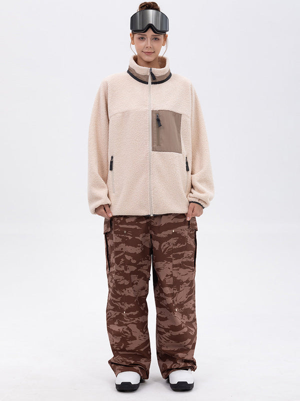 Pantalon de ski ample et fluide pour femme, en polaire imitation sherpa avec fermeture éclair intégrale et genoux renforcés.