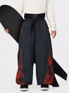 Pantalon de jogging ample de ski pour homme, style graffiti, avec empiècements colorés et bandes réfléchissantes.