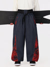 Pantalon de jogging ample de ski pour homme, style graffiti, avec empiècements colorés et bandes réfléchissantes.