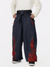 Pantalon de jogging ample de ski pour homme, style graffiti, avec empiècements colorés et bandes réfléchissantes.
