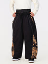 Pantalon de jogging ample de ski pour homme, style graffiti, avec empiècements colorés et bandes réfléchissantes.