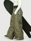 Pantalon de neige ample OG pour femme, style urbain et inspiré des vêtements de travail, avec rivets apparents.