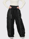 Pantalon de neige extra ample Wild Motion pour femme, à blocs de couleurs réfléchissants.